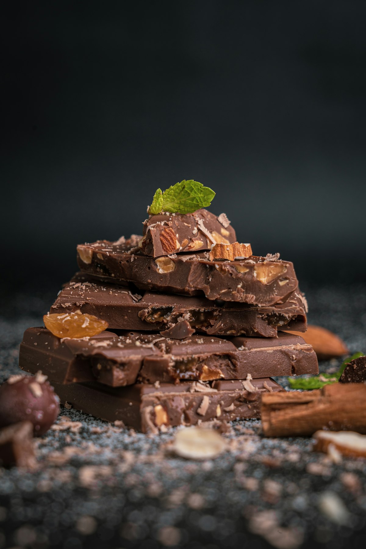 Finished homemade chocolate bars on a wooden board