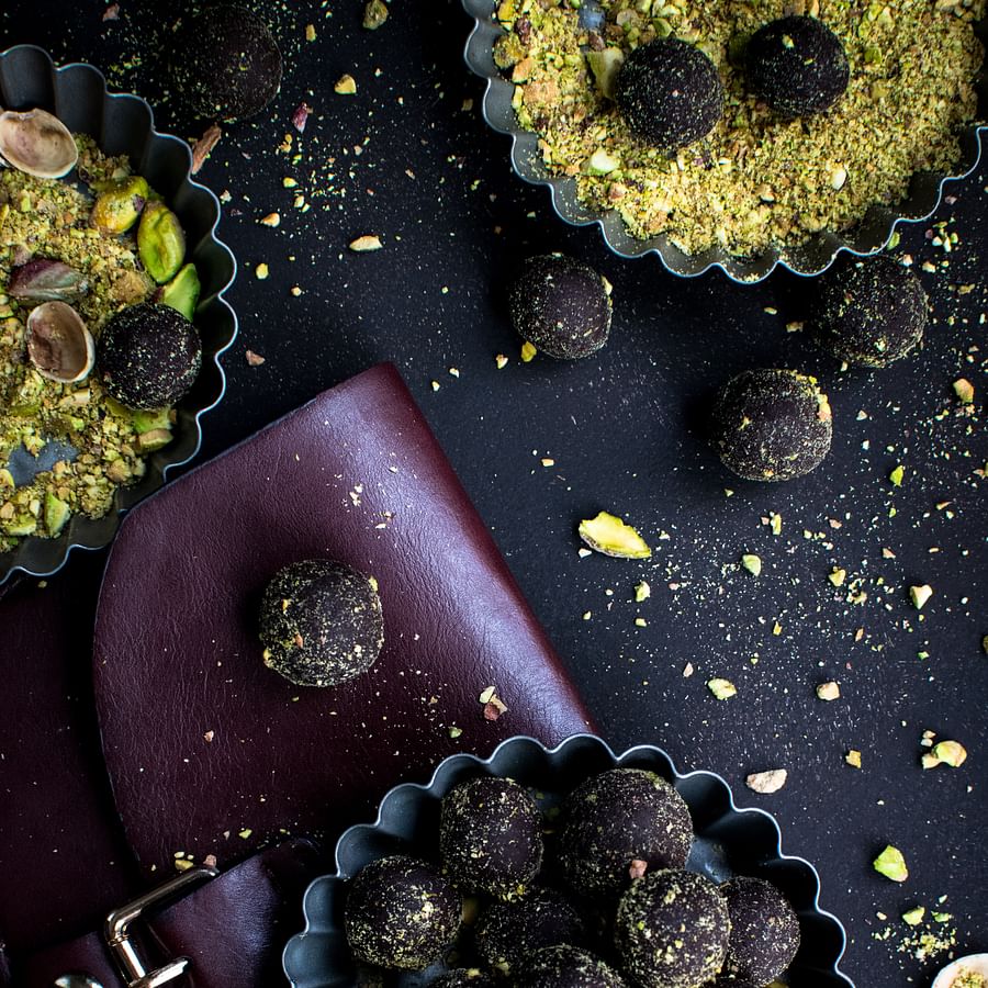 Chocolate fondue pot surrounded by various dipping foods